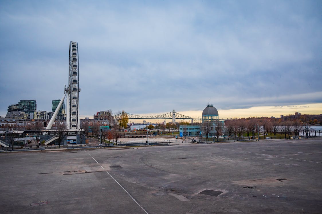 Scenic view of Old Port Montreal with Ferris wheel and St. Lawrence River waterfront