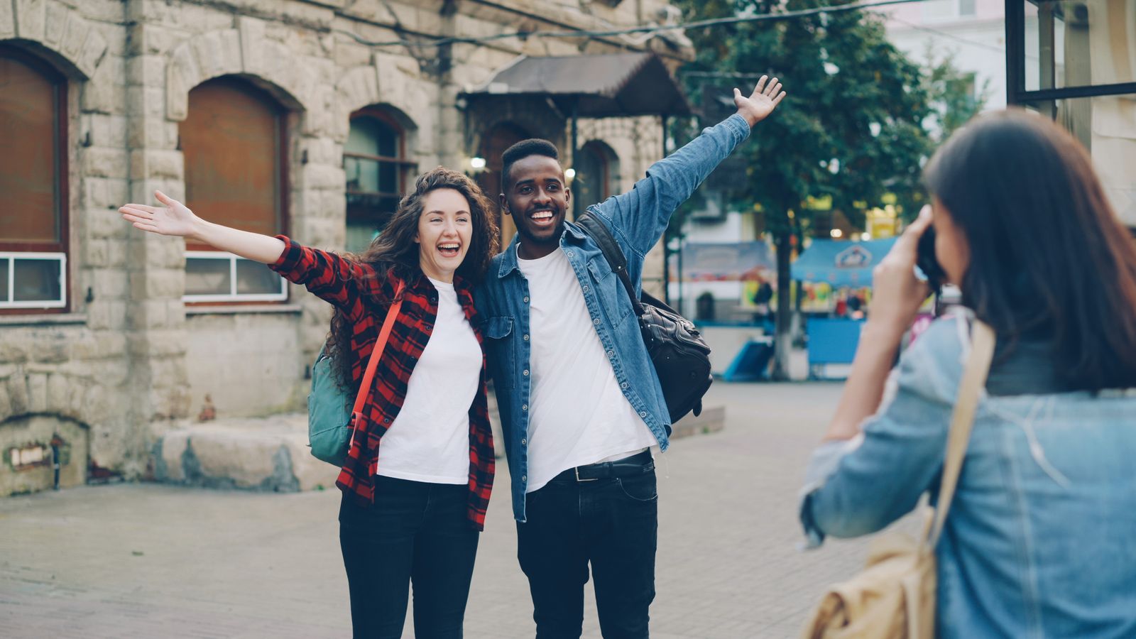 Group of friends celebrating together on a trip planned with a travel planner app