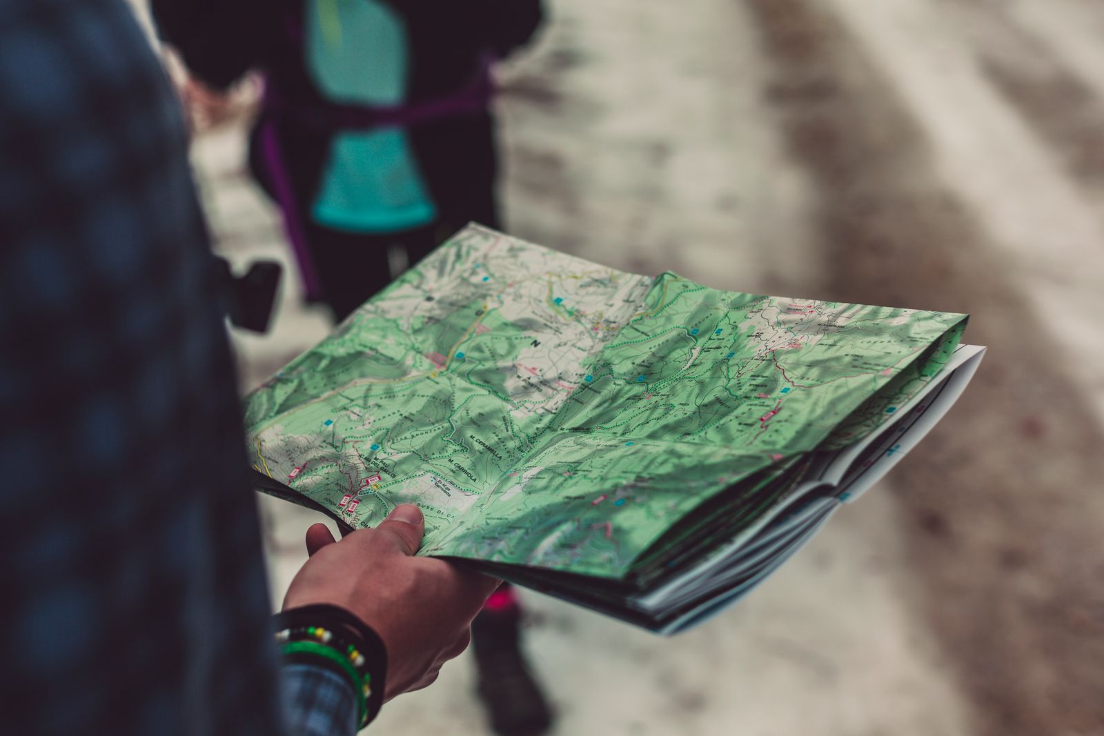 Close up of a traveler holding an outlined route map outdoors