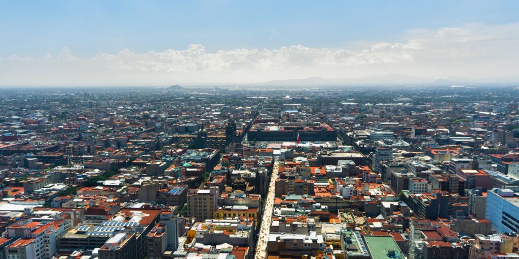 Aerial view of the Mexico City skyline under clear blue skies
