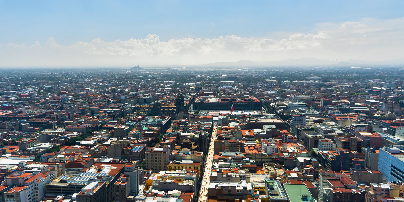 Aerial view of the Mexico City skyline under clear blue skies