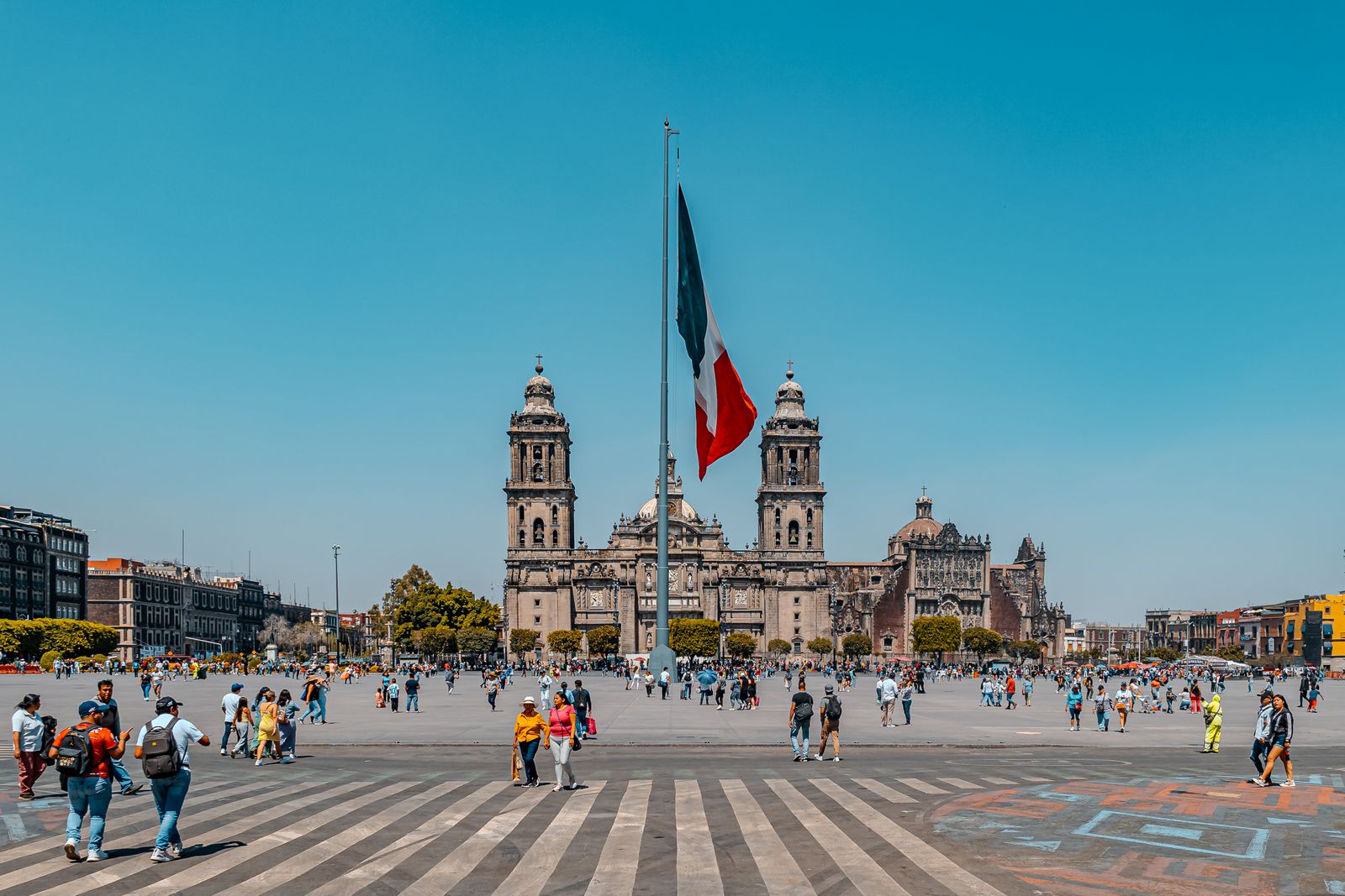 The Zocalo and the Metropolitan Cathedral in the Centro Historico of Mexico City with the national flag flying
