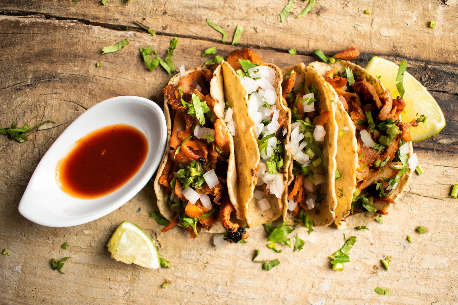 Tacos al pastor with onion, cilantro and lime, the signature street food of Mexico City