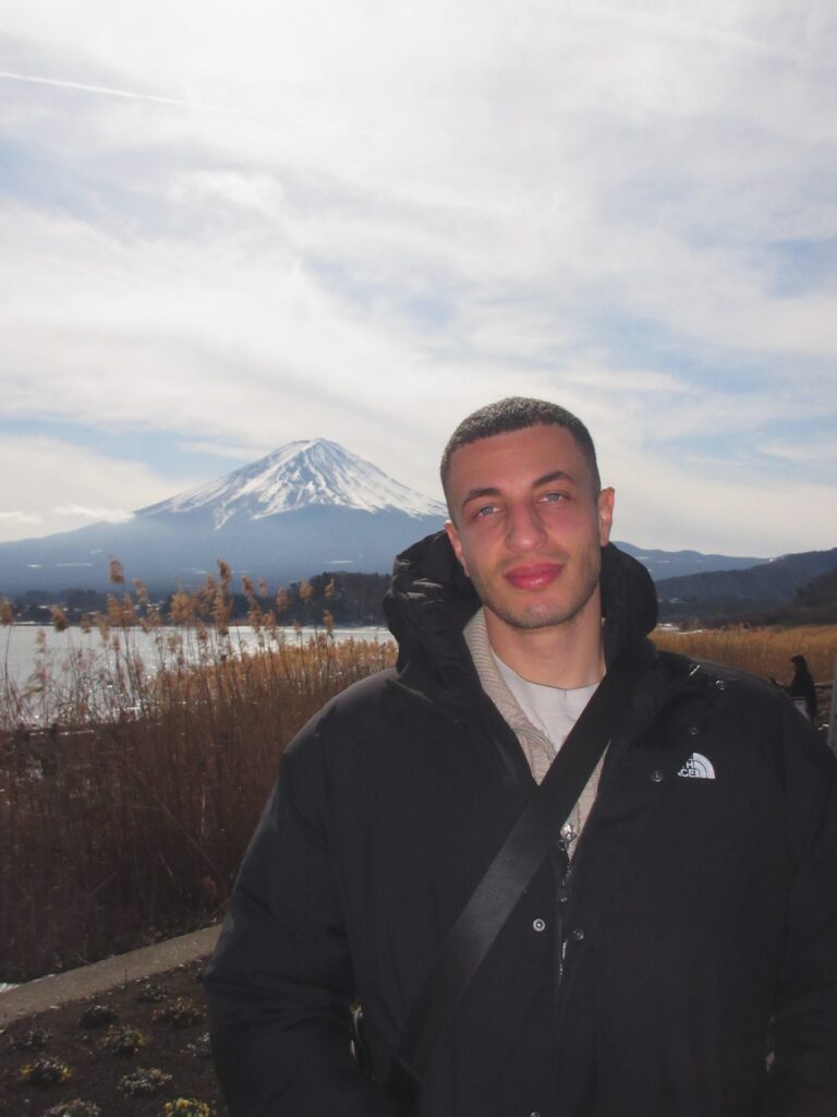 Ryan, founder of The Next Stamp Travel Co., in front of Mt. Fuji, Japan