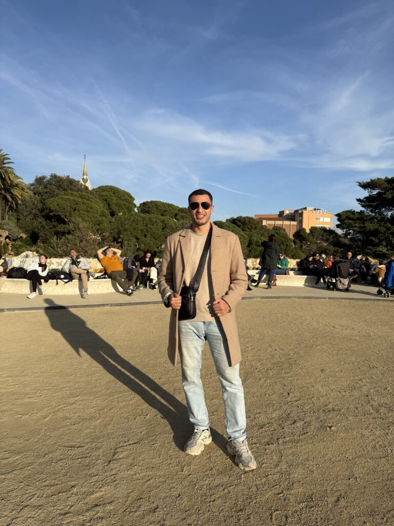 Ryan standing in a sunny plaza
