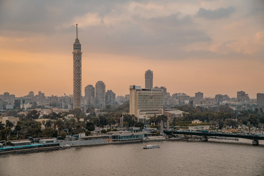 A boat on the Nile in front of Cairo's riverside hotels and buildings