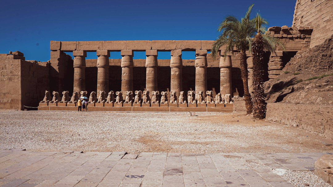 Row of ram-headed sphinxes at the entrance to Karnak Temple in Luxor, Egypt